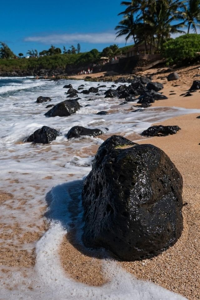 Maui beach in Hawaii with blue ocean, sandy shore, and tropical scenery